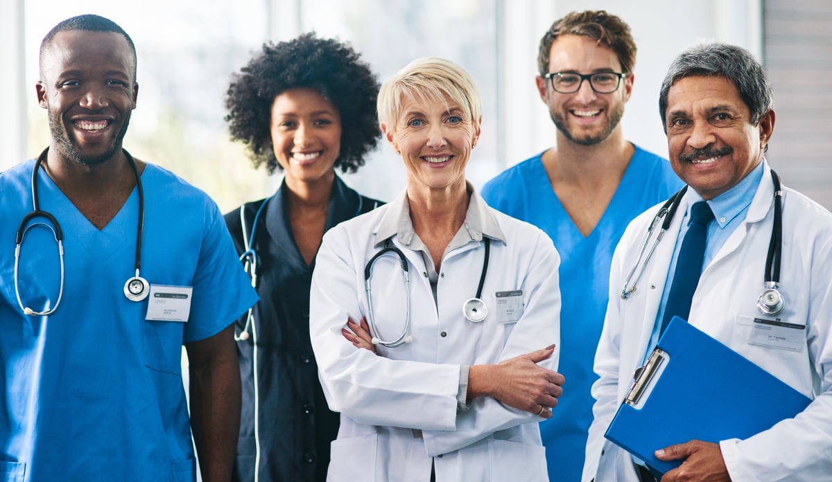 Diverse team of healthcare professionals smiling together